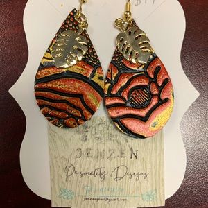 SOLD!! Small textured leather rose leaf charmed.